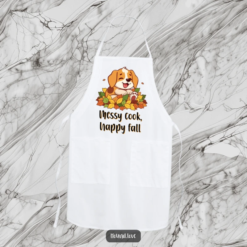 Funny apron with a happy hound character gleefully rolling in a big pile of autumn leaves, bringing outdoor fun to the kitchen.