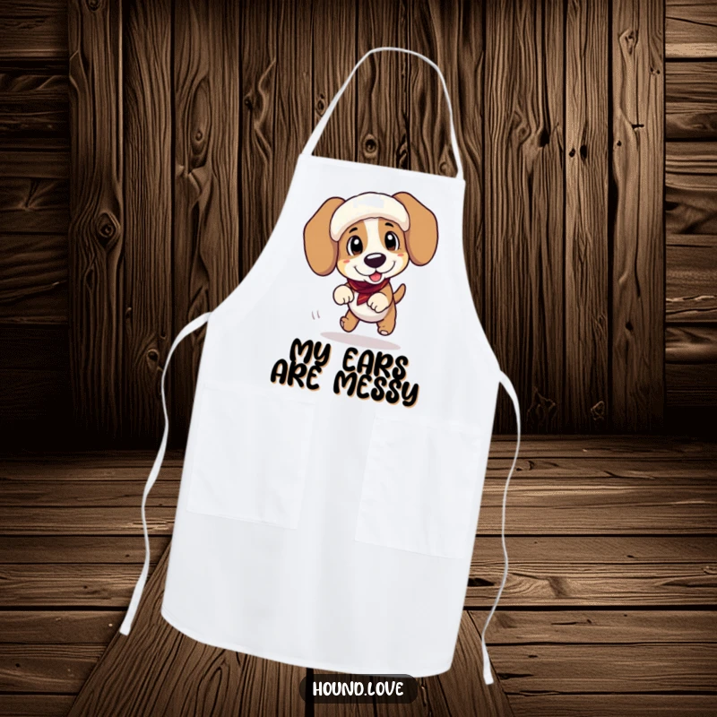 Funny apron with a playful hound character tripping over its floppy ear muffs while in the kitchen, a humorous cooking accessory.