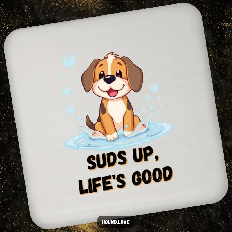 Funny drink coaster showing a happy hound dog character playing and splashing in a puddle full of shimmering soap bubbles, for surface protection.