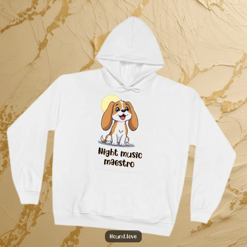Funny hound with long, floppy ears, joyfully baying at the moon, featured on a cozy hoodie, perfect for humor and warmth.