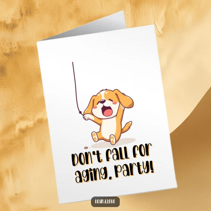 Funny Free Printable Birthday Card of a hound comically falling while comically reaching for a tempting dangling string.