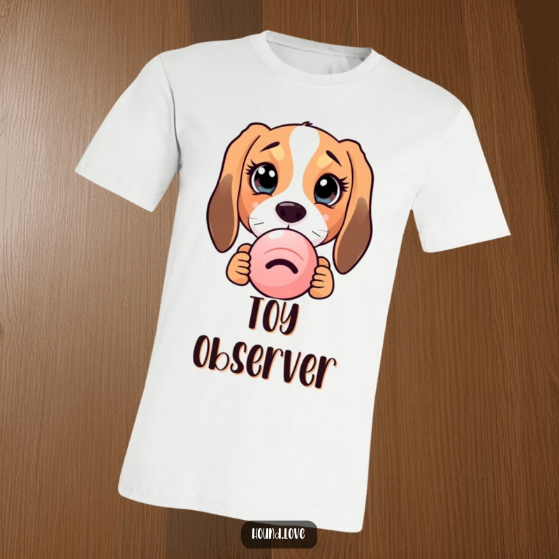 Funny hound dog with massive, curious eyes peeking from behind a squeaky toy on a t-shirt, exuding cuteness.